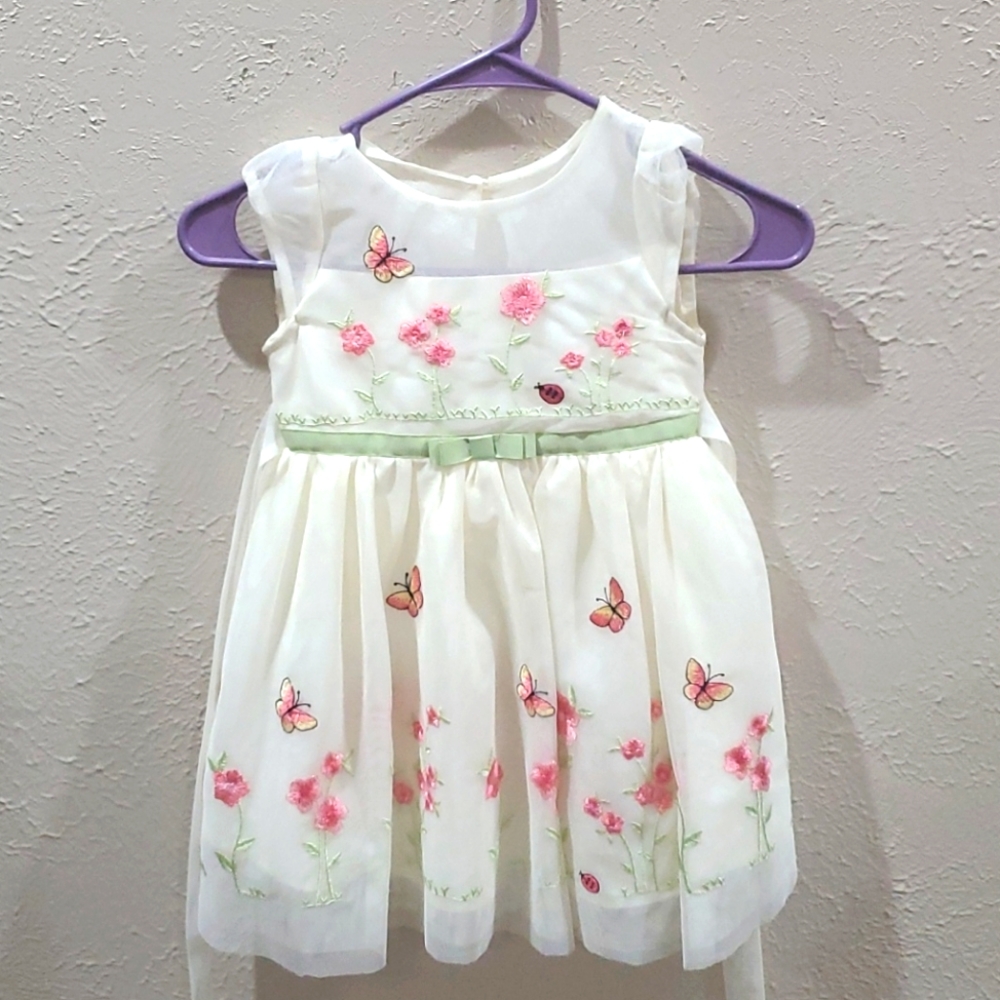 Netted gown with flower and butterfly design